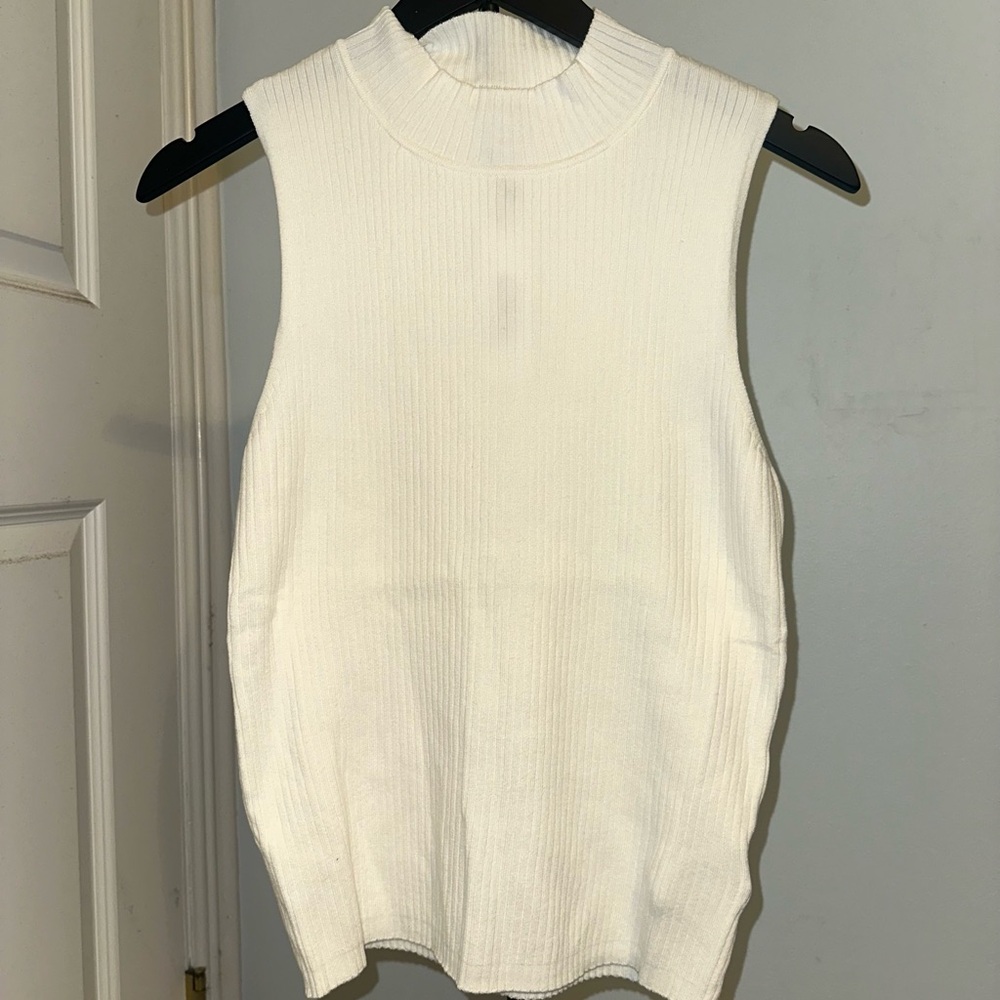 The drop sleeveless ribbed knit turtleneck top